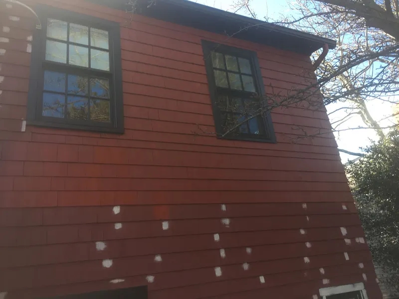 Siding patched and prepped before exterior paint