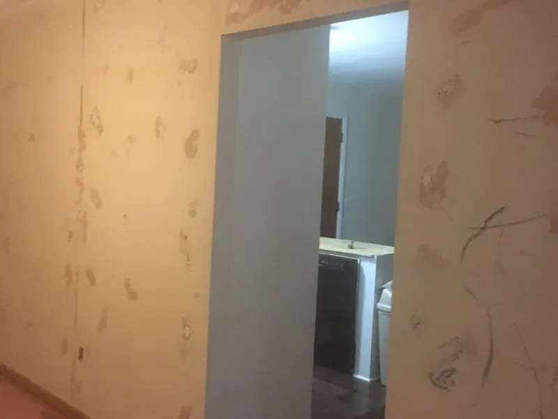 Joint compound patches drying on a wall before sanding