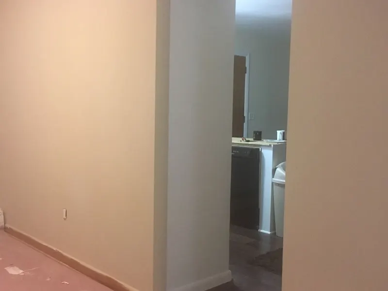 Smooth skim-coated wall primed and ready for paint