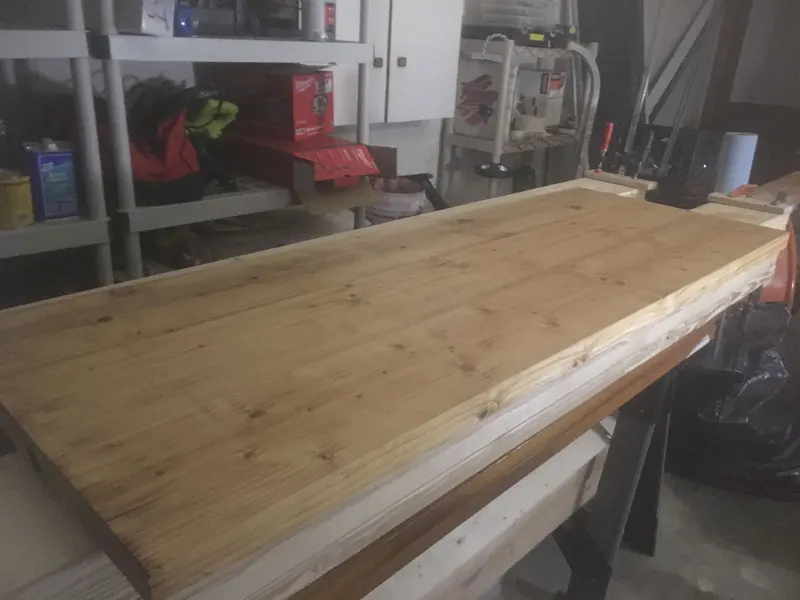 Pine countertop slab sanded smooth in the workshop