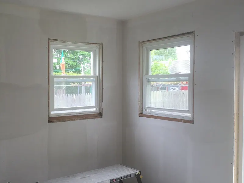 Freshly painted room with two windows