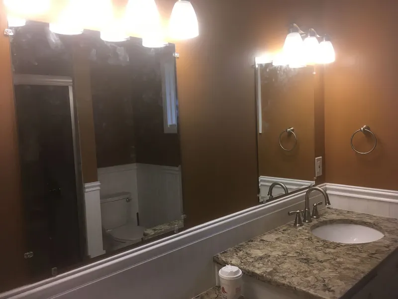 Bathroom with freshly painted walls above wainscoting
