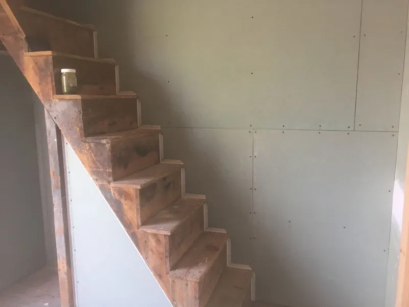 New drywall hung along a staircase