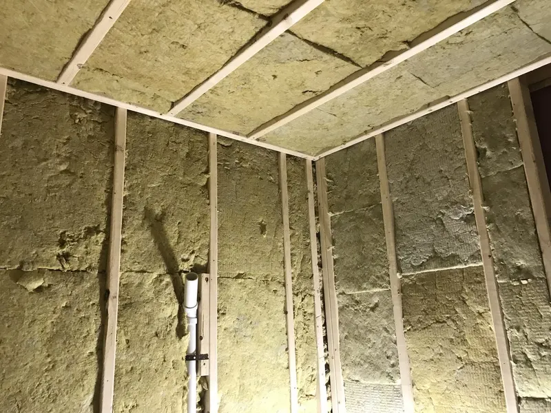 Recording booth walls and ceiling packed with sound insulation