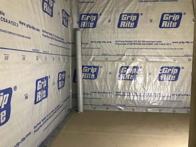 Recording booth wrapped in underlayment before finishing