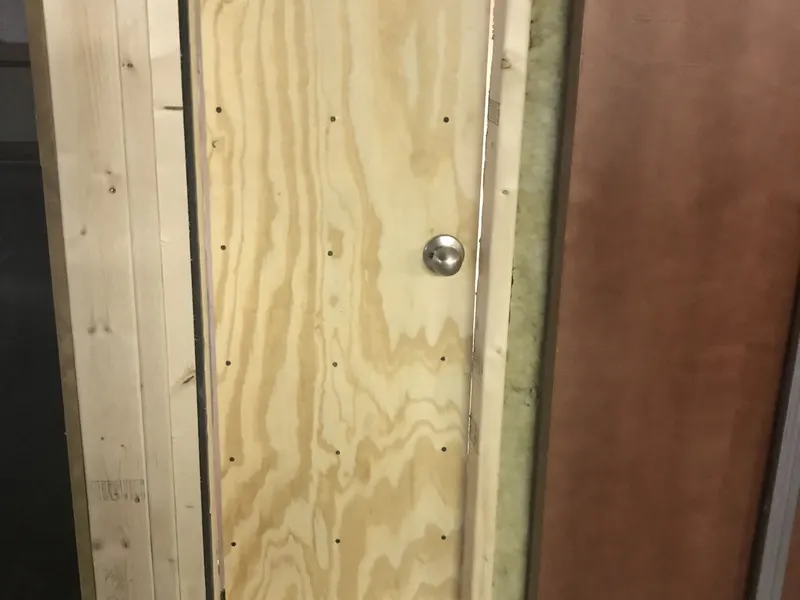 Recording booth door built from plywood