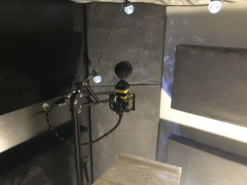 Finished recording booth with microphone and acoustic treatment