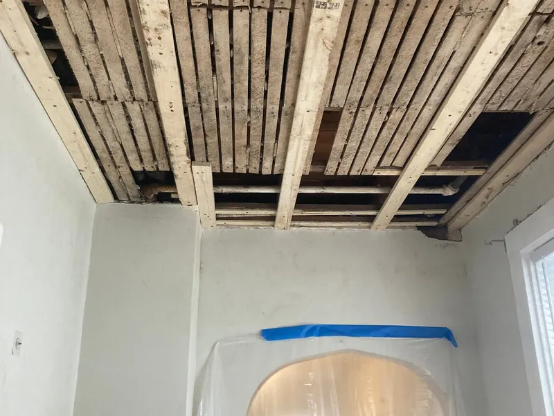 Ceiling opened down to the lath before drywall replacement