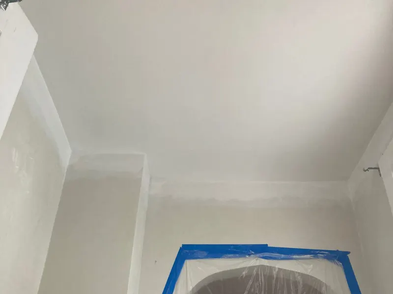 New ceiling finished and walls prepped, with the archway masked off